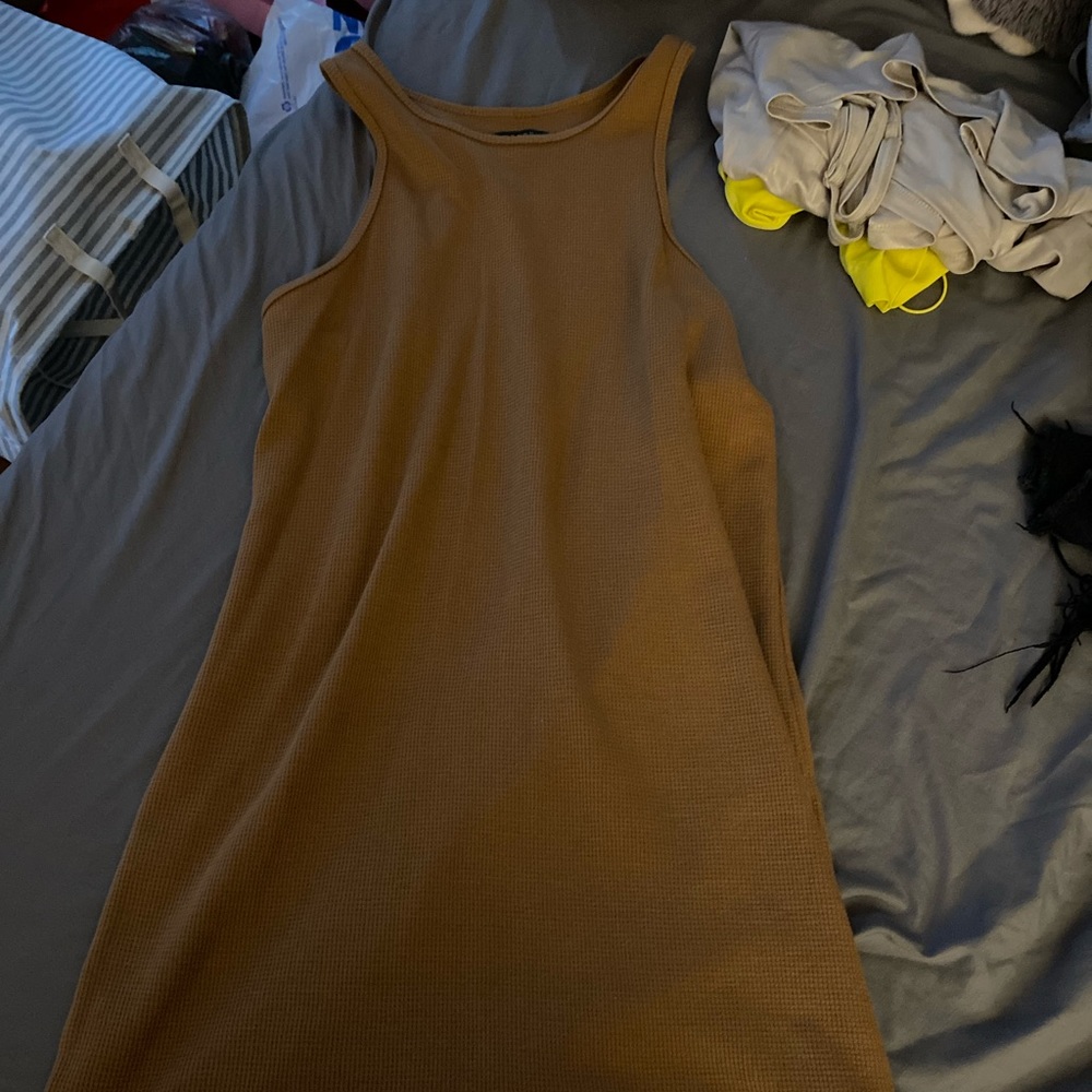 tan dress, tight with a halter neck, never worn not for taller girls.